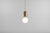 Golden aballs t me pendant lamp by parachilna dimensions: d 24 x h 50 cm. Materials: handmade ceramic body, blown opal...