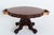 Mahogany French Centre Table. The Table Stands Upon a Quatrefoil Base with Heavily Carved and Shaped Legs and a Central...