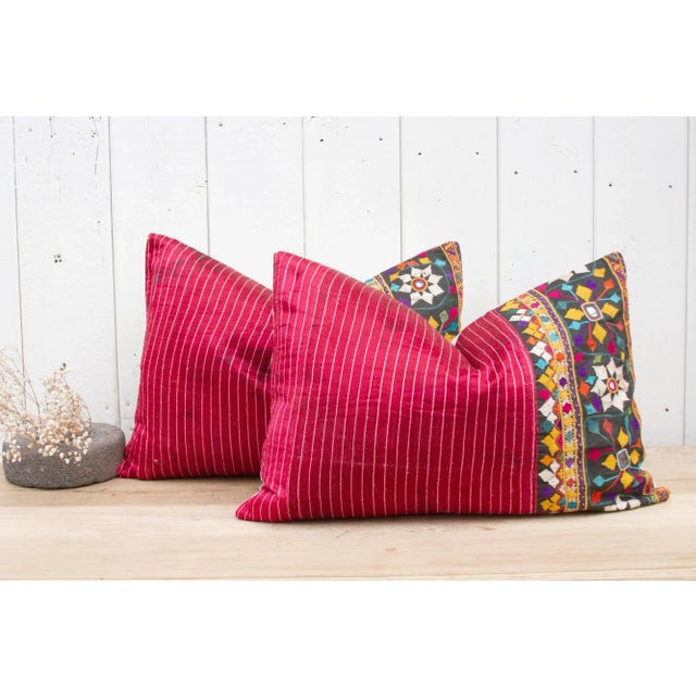 Pair of beautiful Mashru silk lumbar pillows with a lovely embroidered tribal border of geometric and floral motifs....