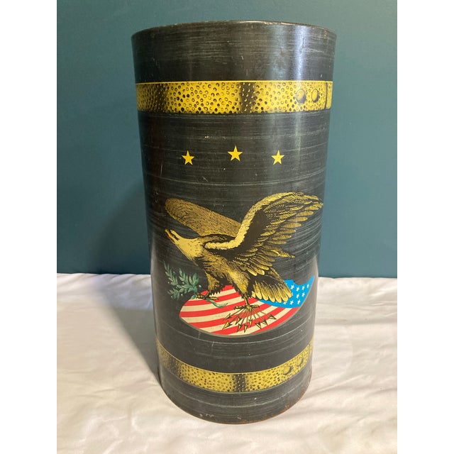 This vintage metal umbrella holder features a bold American eagle design set against a stars-and-stripes shield, offering...