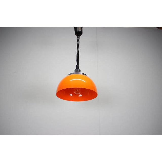 An original Mid-Century modern adjustable plastic pendant lamp designed and manufactured by Meblo in Italy during the...