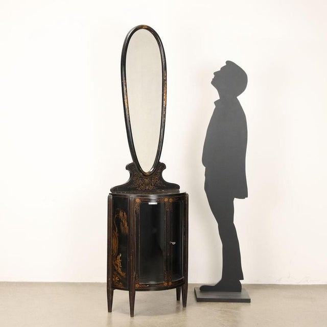 Demi-lune display cabinet with finely ebonized and gold-painted mirror with chinoiserie motifs, beveled glass and mirror....