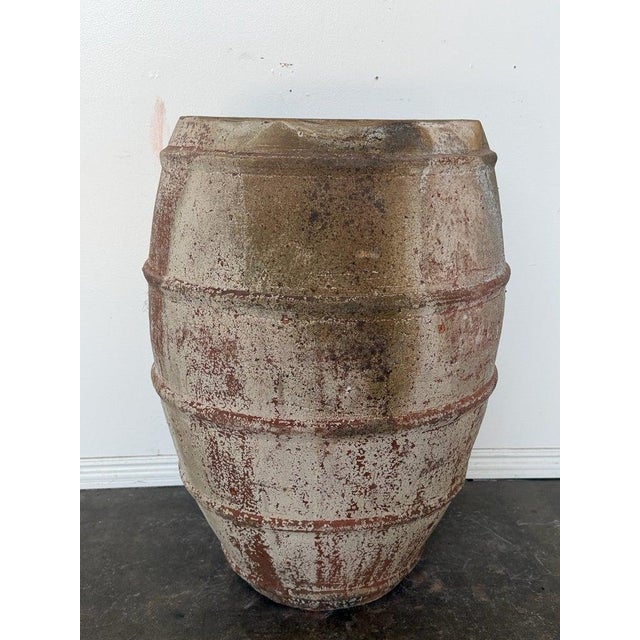 A commanding and sculptural large-scale barrel-form planter in the timeless tradition of the Mediterranean olive jar. The...