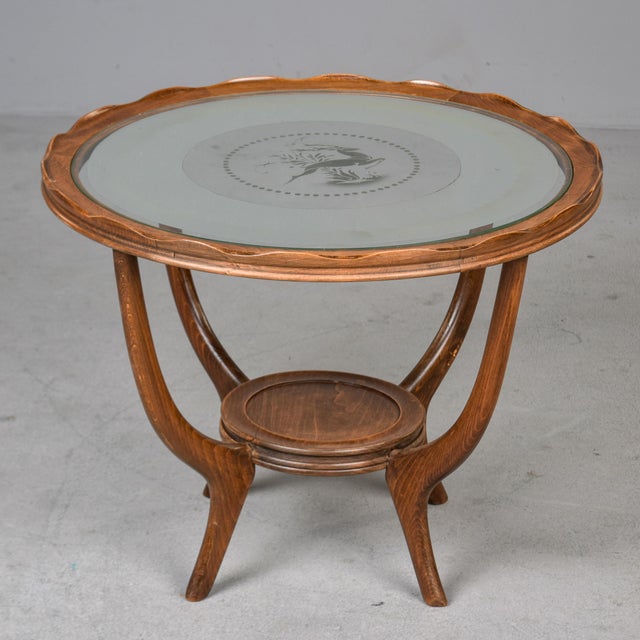 Found in France, this round side table or gueridon dates from the 1930s. We believe the frame is made of walnut with a...