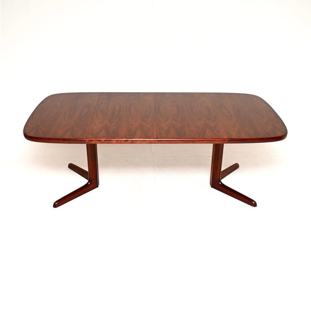 A stylish and top quality Danish vintage extending dining table, made in Denmark and dating from the 1960’s. This is of...