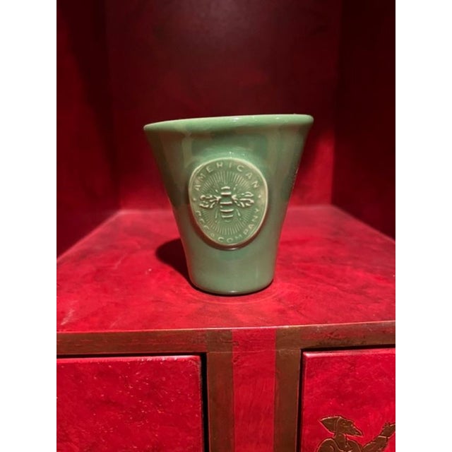 These charming ceramic pots feature a signature embossed seal of the American Bee Company on the front. With its distinct...