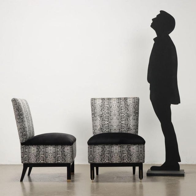 Two vintage Italian-made armchairs with foam padding and jungle-themed velvet covering. This piece is attributed to the...