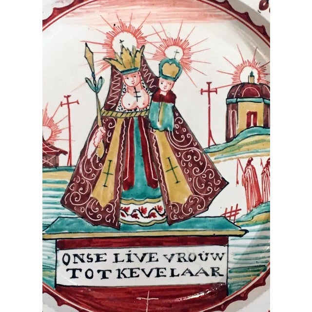 Dutch-Decorated English Creamware Plate Onse Live Vrouw Tot Kevelaar (Our Lady of Kevelaer) A rare and historically...