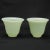 A pair of wine cups made from Chinese Peking glass during the 1920s that resemble the color and translucence of jade. The...