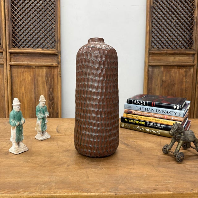 "About This Piece About This Piece Step into a world where strength meets artistry with this commanding ceramic vase. Its...