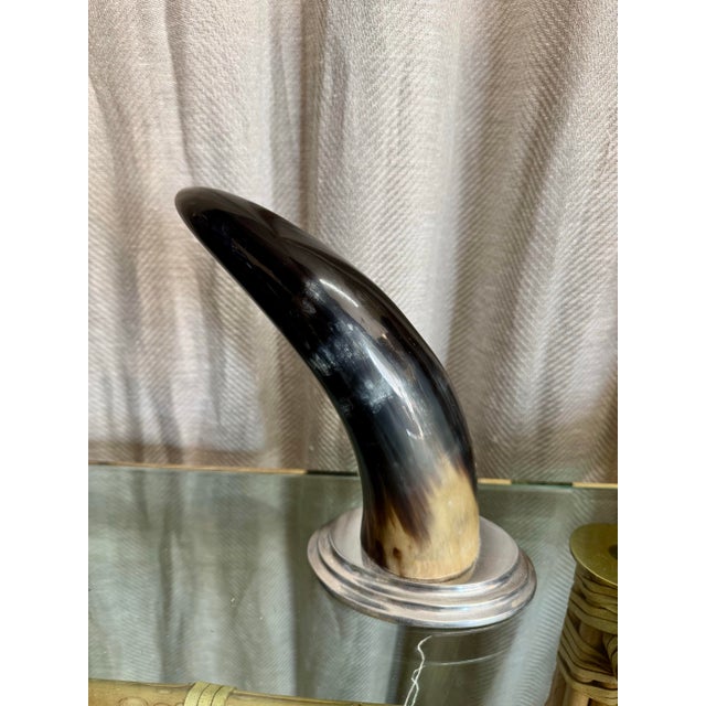 Vintage C.1980 steer horn mounted on oval shape pewter base.