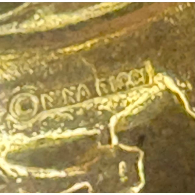 1980s-90s Nina Ricci gold tone/green stone/rhinestone swirl brooch. Marked at back. Excellent condition.