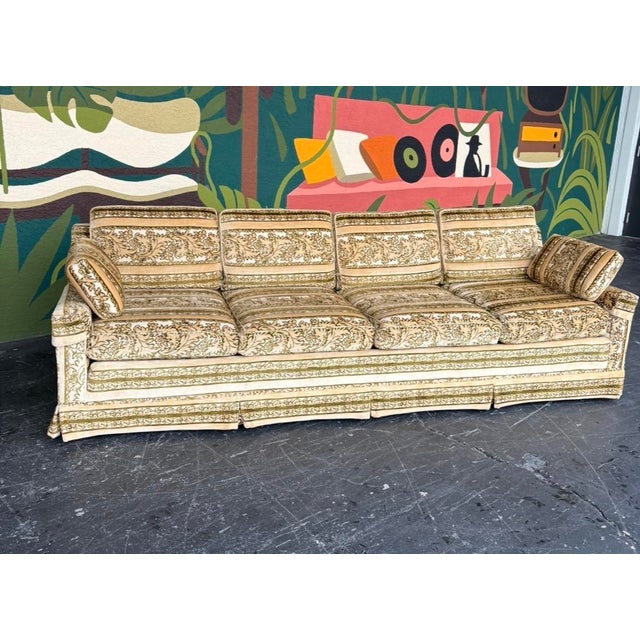 Classic mid century 4-seater sofa by Broyhill. Plush green and cream floral velvet with a matching skirt concealing 6...