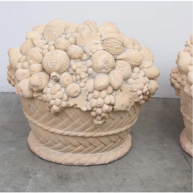 Pair of large french terra cotta fruit baskets. Beautifully detailed with soft patina