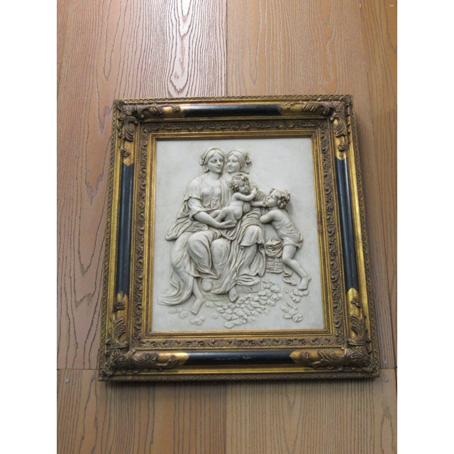 Beautiful vintage classical relief wall plaque featuring a dimensional mother-and-cherubs scene rendered in an ivory-toned...