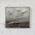 An oil on canvas seascape by Francine Kerckx, a quiet meditation on the sea and the sky. A vast, clouded sky fills most of...