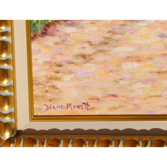 Illuminated in afternoon light, this seaside scene by Diane Monet focuses on a mother and child enjoying a leisurely...