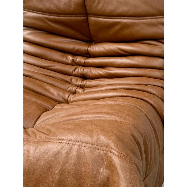 This Togo is restored. A part of the padding has been replaced and thereafter the Togo is reupholstered in quality...