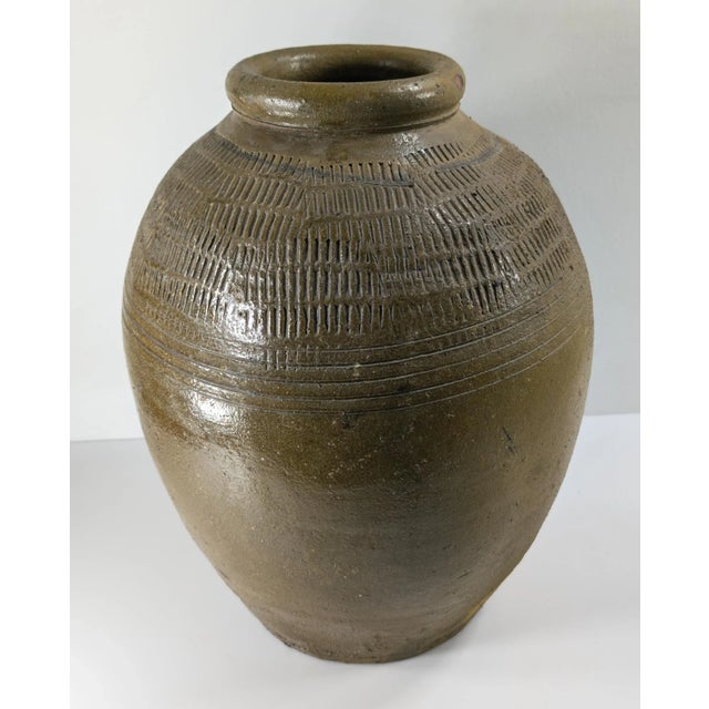 We are selling this large decorative Olive green glazed pottery vessel. This Chinese or South East Asian Martaban type...