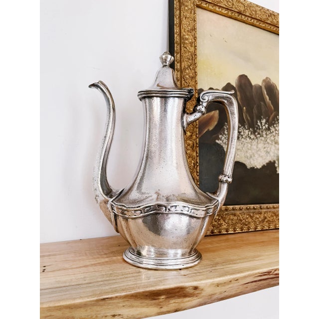 An antique circa 1910-20s silver plated coffee pot from The Webster Hotel in New York City. In great condition, no major...