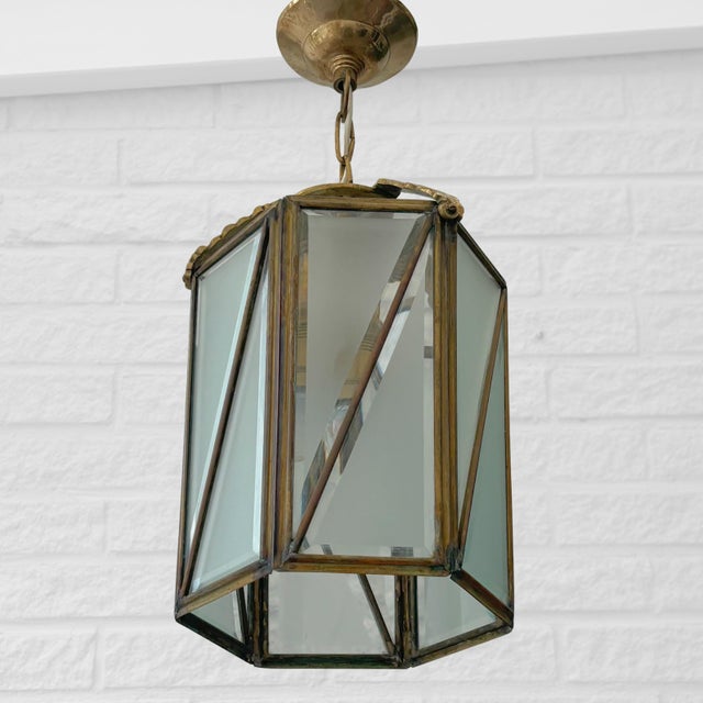 An elegant Swedish lantern pendant manufactured by Bröderna Malmströms Metallvarufabrik in the 1920s. The lantern features...