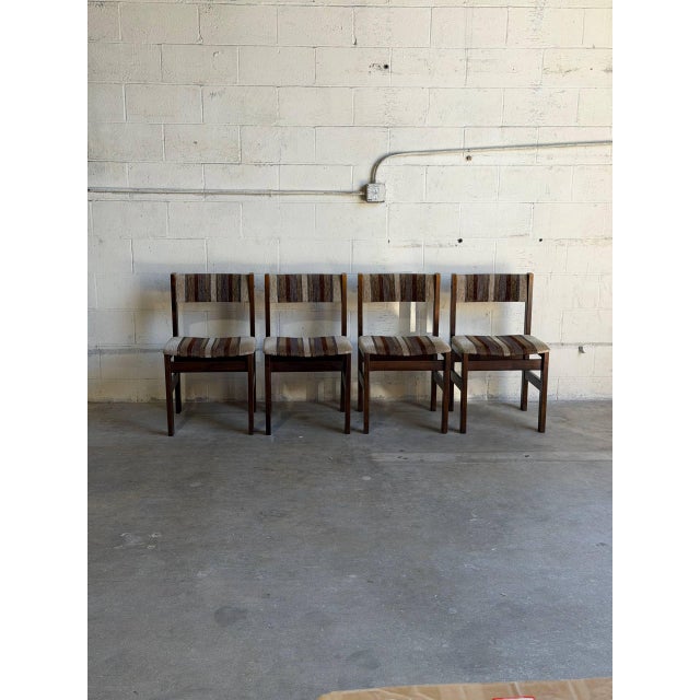 Vintage set of 4 Danish Mid-Century Modern dining chairs featuring clean minimalist lines, beautifully crafted solid wood...