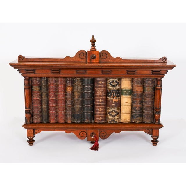 This is an elegant early Victorian solid walnut table top collectors cabinet, circa 1840 in date. The rectangular cabinet...