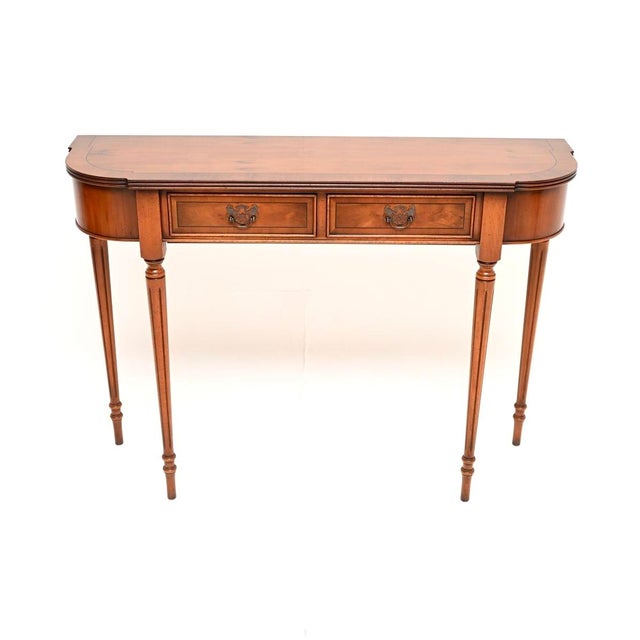 A beautiful and elegant antique Regency style yew wood console table. This was made in England, it dates from around the...