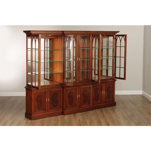 American-made and vintage 6-door display cabinet or china cabinet with locking doors by Millender Furniture. This cabinet...