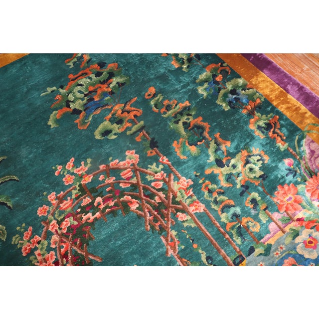Stunning room size 20th century Chinese Art Deco carpet with a colorful floral design in bright green, coral mustard and...