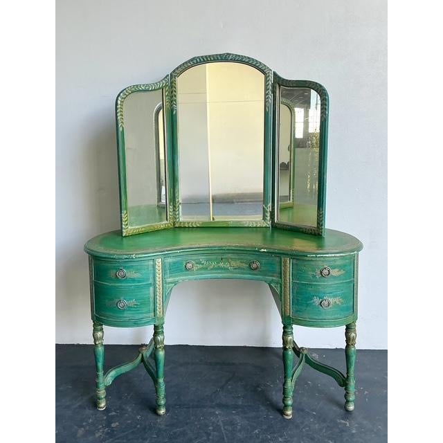 This enchanting vintage vanity captures the romantic allure of French Provincial and Neoclassical design through a...