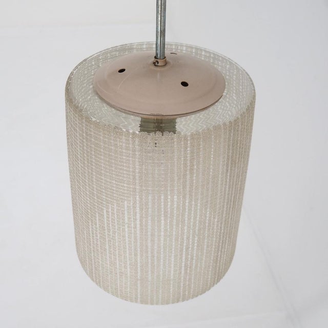 This pendant lamp, a refined example of mid-century European lighting design, was designed by Aloys Gangkofner, a designer...