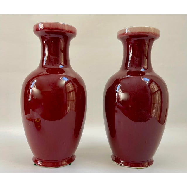 Vintage Tall Chinese porcelain oxblood vases. Both in excellent condition.
