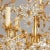 Gilded eight-light chandelier, the striking contrast of glass daisies with the gilt finish creates an organic feel and...