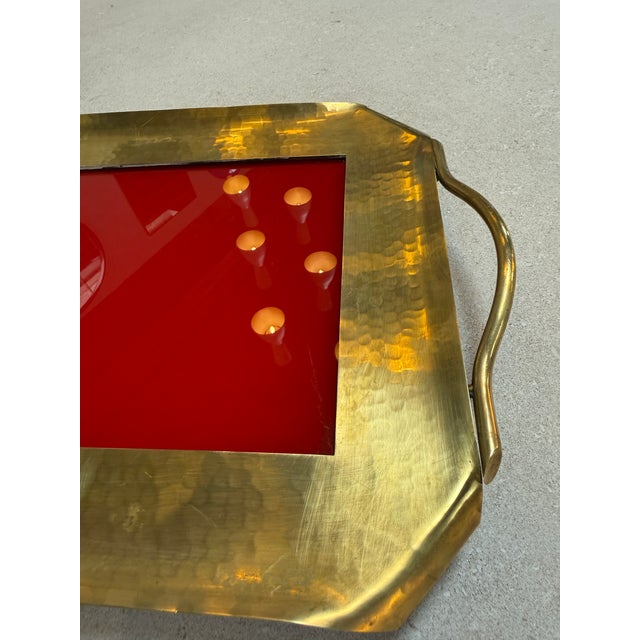 Mid-century Italian serving tray crafted with a hammered brass frame and integrated side handles, centered with a vivid...