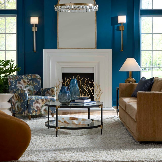 This Elegant Coffee Table Features A Sleek Black Iron Frame With Sophisticated Gold Accents. It Includes Two Tempered...