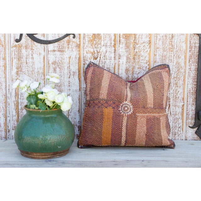 Quilted by the gypsy woman of the Saami community often reusing fabrics from clothing. This antique tribal pillow feature...