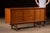c. 1960s; United Furniture Corporation - Lexington, NC Mid-century walnut modern dresser featuring a clean architectural...