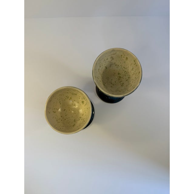 Charming studio pottery goblets for decor and accent use in the home. The exterior is glazed blue in a high gloss and the...