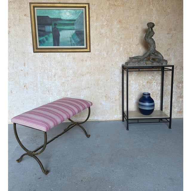 This elegant Spanish gilt iron bench is newly handcrafted by skilled European artisans using traditional ironworking...