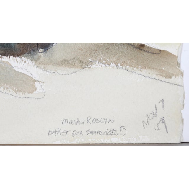 Tinted in a soft purple hue, the wooden fence with posts obscures the viewer's perspective of the mountain landscape....