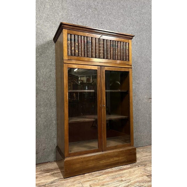 Rare notary's bookcase with a concealed secret writing desk, Napoleon III period, circa 1850 Made of mahogany, it opens...