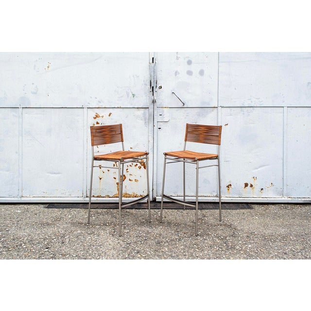 Stool with stainless steel structure, leather seat and back. Model Miss B Designer Tito Agnoli Producer Bonacina Year 1997...