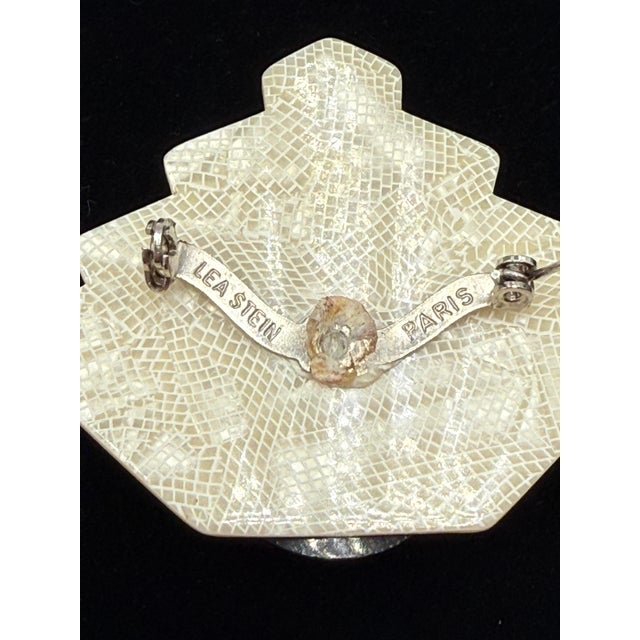 Deco style fan brooch / pin by French designer Lea Stein. It is made of laminated cellulose acetate, is signed and...