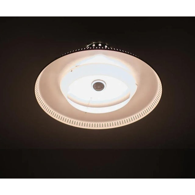 Beautiful pendant lamp. Manufactured by Philips Design by Louis Kalff 1950s Holland Grey perforated metal base, comes with...