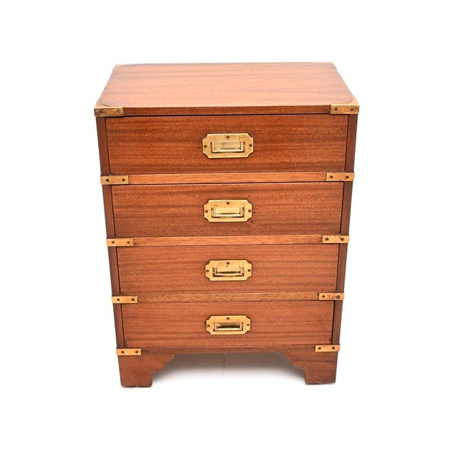 A smart and compact antique military campaign style chest of drawers. This was made in England, it dates from around the...