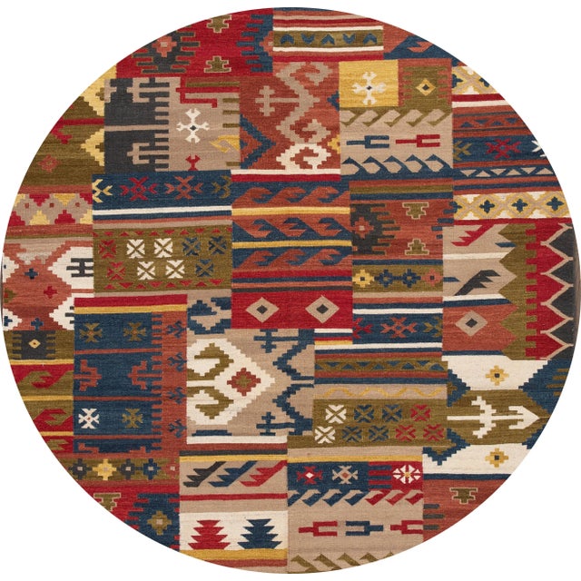 A beautiful hand-woven modern Kilim rug with a tan field and multi-color accents in an all-over geometric design. This rug...