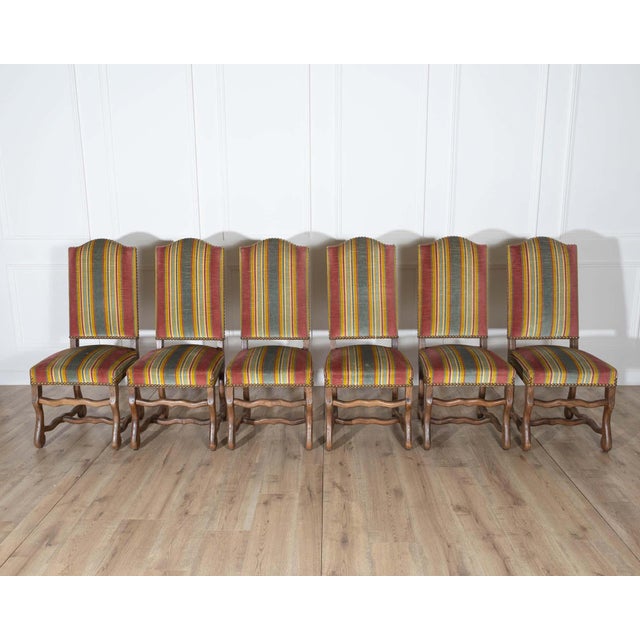 This striking set of six dining chairs showcases the enduring craftsmanship and robust character of traditional pegged oak...