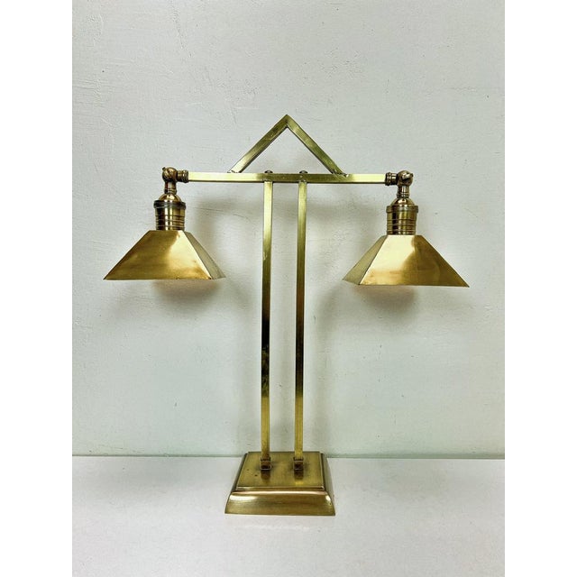 Wonderful stately Art Deco desk lamp Amsterdam School. Made of brass in a beautiful design. The shades are adjustable. In...