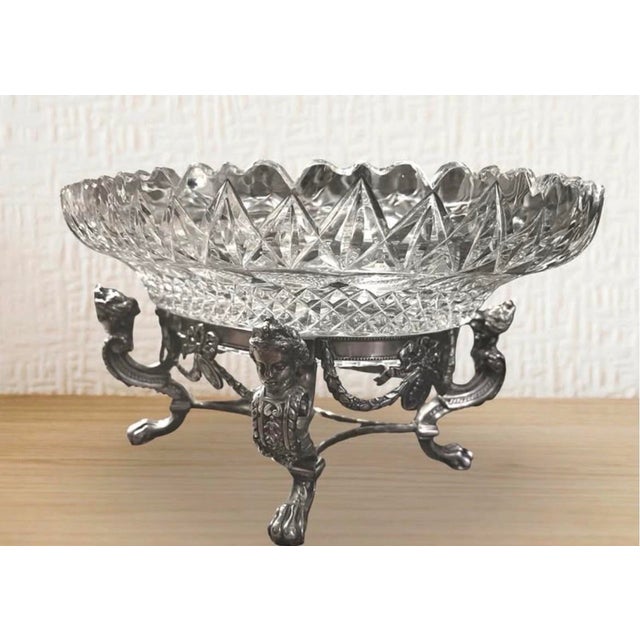 1. Elegant vintage cut crystal centerpiece bowl with ornate silverplate figural pedestal base featuring classical...